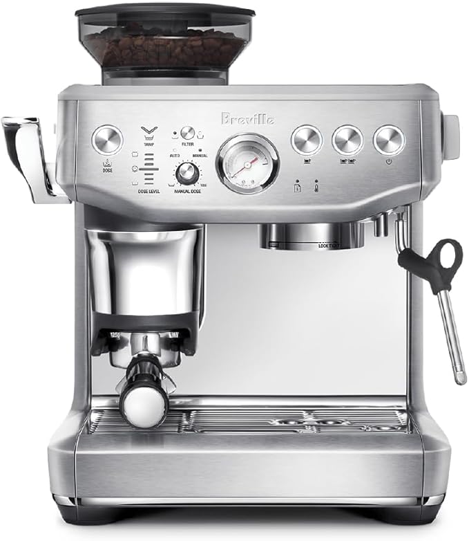 Breville Barista Express Impress espresso machine with portafilter locked in and grinder hopper filled with beans