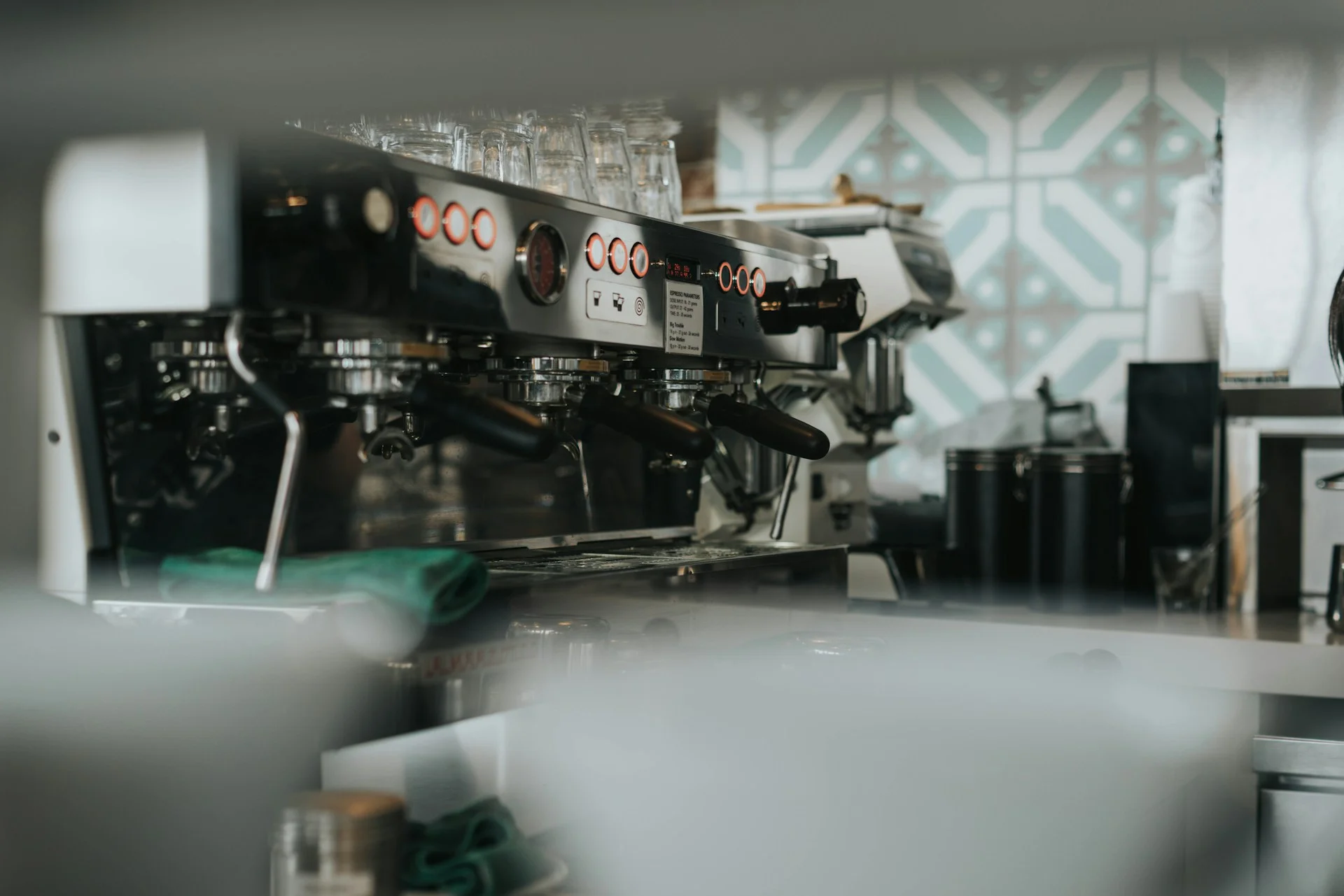 Commercial espresso machine with multiple group heads in a professional café setup