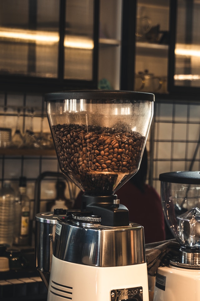 Beginner-friendly espresso grinders and coffee gear on a counter